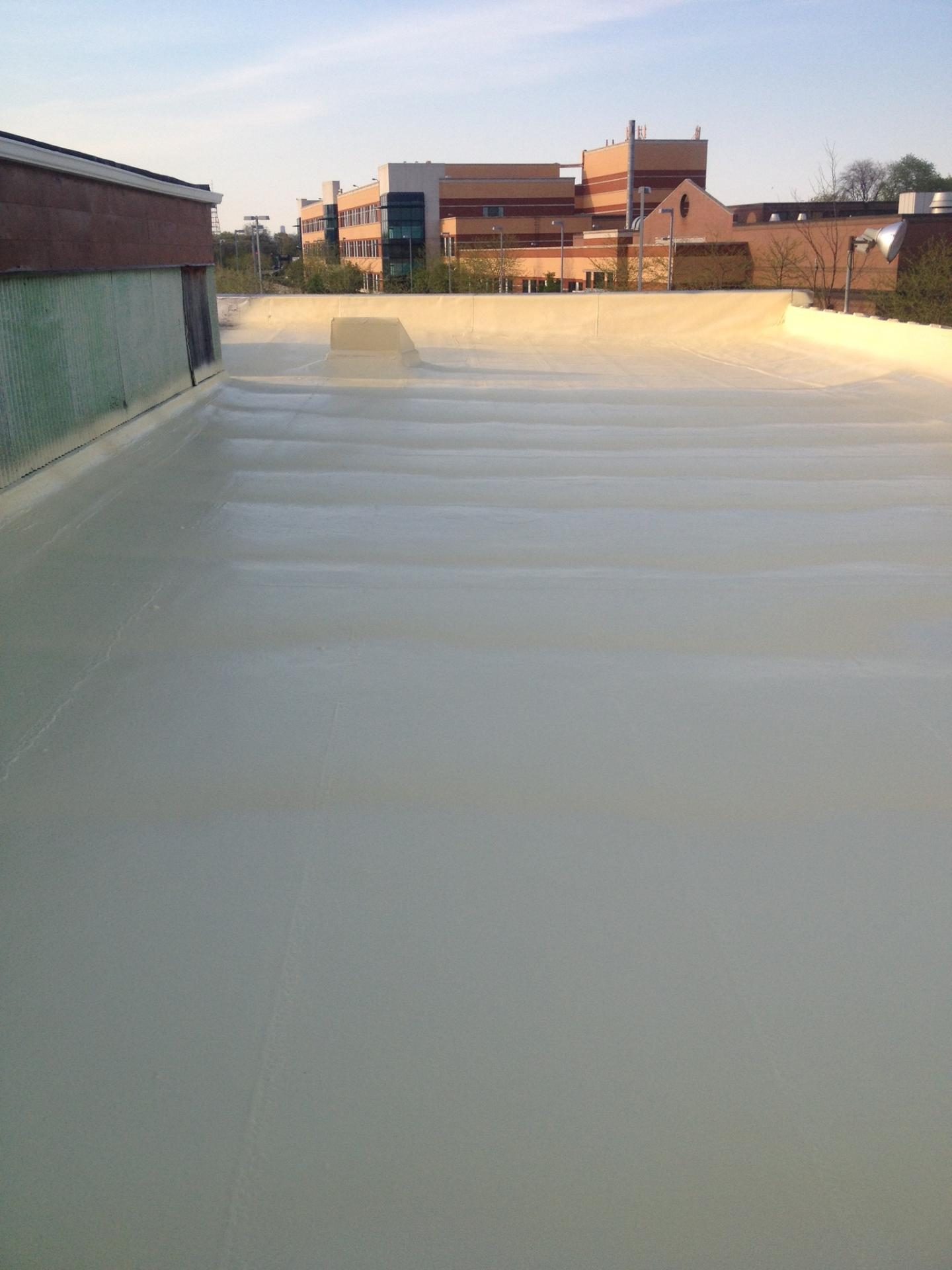 Residential roof restored with a seamless liquid-applied membrane